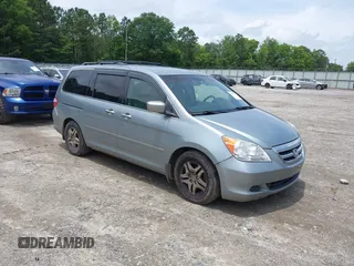 2006 Honda Odyssey EX with VIN 5FNRL38476B004712, listed as a IAAI auction lot 42501494 with 235,186 mi miles and . Bid and sale history available at DreamBid. Image 1.