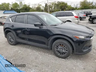 2020 Mazda CX-5 Touring with VIN JM3KFBCM1L0792706, listed as a Copart auction lot 73032144 with 56,845 mi miles and Salvage Title. Bid and sale history available at carsss.com. Image 4.
