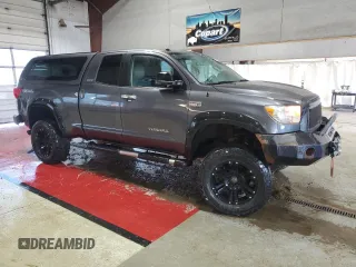 2011 Toyota Tundra 4WD Truck LTD with VIN 5TFBY5F15BX196980, listed as a Copart auction lot 51797675 with 124,080 mi miles and Salvage Title. Bid and sale history available at carsss.com. Image 4.