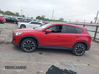 2016 Mazda CX-5 Grand Touring with VIN JM3KE2DY8G0871574, listed as a IAAI auction lot 41959686 with 95,416 mi miles and . Bid and sale history available at DreamBid. Image 14.