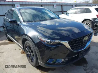 2023 Mazda CX-9 Touring Plus with VIN JM3TCBAY2P0657761, listed as a IAAI auction lot 41125586 with 12,425 mi miles and . Bid and sale history available at DreamBid. Image 1.