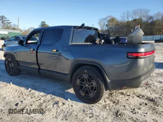 2023 Rivian R1T Adventure z VIN 7FCTGAAA1PN022134, wystawiony jako Copart lot #85545774 z przebiegiem 48 951 mil mil oraz Szkoda całkowita • Salvage title. Historia ofert i sprzedaży dostępna na DreamBid. Obrazek 2.