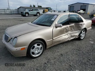 2001 Mercedes-Benz E-Class with VIN WDBJF70JX1B220786, listed as a Copart auction lot 71808344 with 94,476 mi miles and Salvage Title. Bid and sale history available at carsss.com. Image 1.