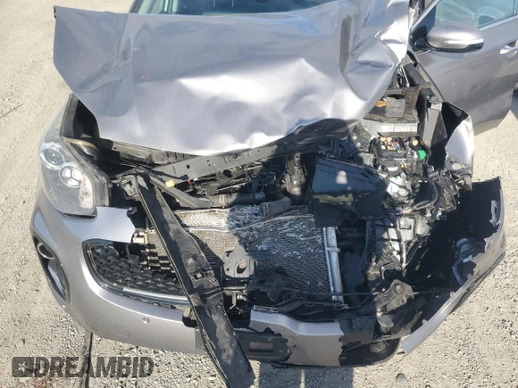 2018 Kia Sportage EX z VIN KNDPNCAC1J7308457, wystawiony jako Copart lot #81574704 z przebiegiem Nie podano mil oraz Szkoda całkowita • Salvage title. Historia ofert i sprzedaży dostępna na DreamBid. Obrazek 13.