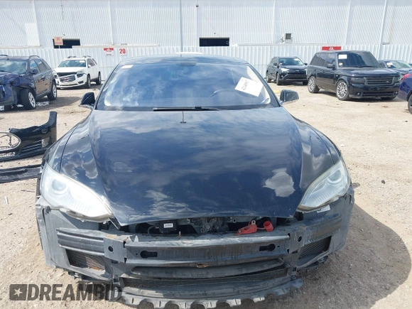2014 Tesla Model S 60 z VIN 5YJSA1H1XEFP44397, wystawiony jako IAAI lot #42140917 z przebiegiem 136 515 mil mil oraz . Historia ofert i sprzedaży dostępna na DreamBid. Obrazek 13.