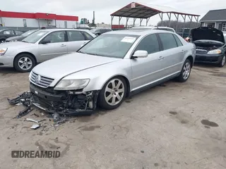 2004 Volkswagen Phaeton V8 z VIN WVWAF63D548007862, wystawiony jako IAAI lot #41721419 z przebiegiem 87 974 mil mil oraz . Historia ofert i sprzedaży dostępna na DreamBid. Obrazek 2.