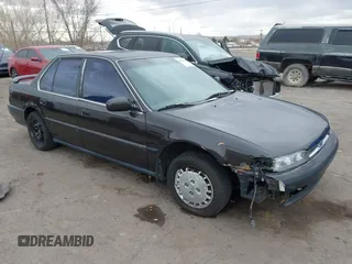1991 Honda Accord LX with VIN JHMCB7653MC090847, listed as a IAAI auction lot 41561641 with 163,258 mi miles. Bid and sale history available at carsss.com. Image 1.