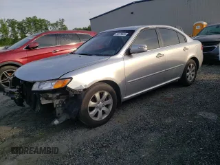 2009 Kia Optima LX z VIN KNAGE228195332931, wystawiony jako Copart lot #55279665 z przebiegiem 295 523 mil mil oraz Szkoda całkowita • Salvage title. Historia ofert i sprzedaży dostępna na DreamBid. Obrazek 1.