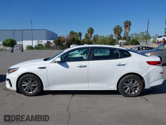 2019 Kia Optima LX with VIN 5XXGT4L33KG324175, listed as a IAAI auction lot 42139795 with 105,273 mi miles. Bid and sale history available at carsss.com. Image 14.