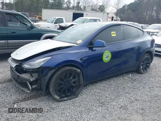2021 Tesla Model Y Standard Range with VIN 5YJYGDED8MF122985, listed as a IAAI auction lot 41430423 with 120,302 mi miles and . Bid and sale history available at carsss.com. Image 13.