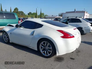 2014 Nissan 370Z Touring with VIN JN1AZ4EH7EM635655, listed as a IAAI auction lot 42217280 with 150,200 mi miles and . Bid and sale history available at DreamBid. Image 4.