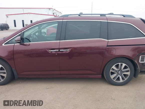 2014 Honda Odyssey Touring with VIN 5FNRL5H97EB117971, listed as a IAAI auction lot 41794324 with 198,191 mi miles and . Bid and sale history available at DreamBid. Image 14.