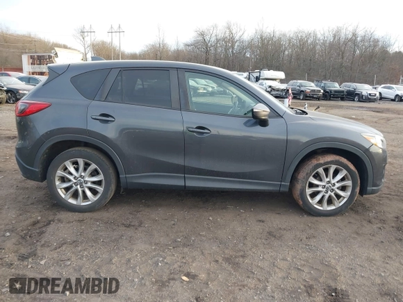 2015 Mazda CX-5 Grand Touring with VIN JM3KE4DY5F0470445, listed as a IAAI auction lot 41236468 with 87,845 mi miles. Bid and sale history available at carsss.com. Image 13.