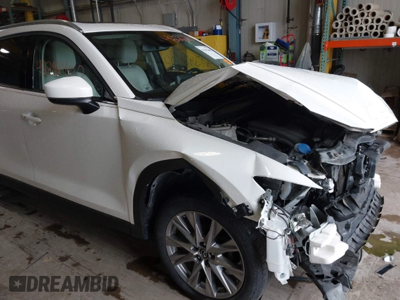2020 Mazda CX-5 Grand Touring with VIN JM3KFADMXL0742038, listed as a IAAI auction lot 42292400 with 68,339 mi miles and . Bid and sale history available at DreamBid. Image 18.