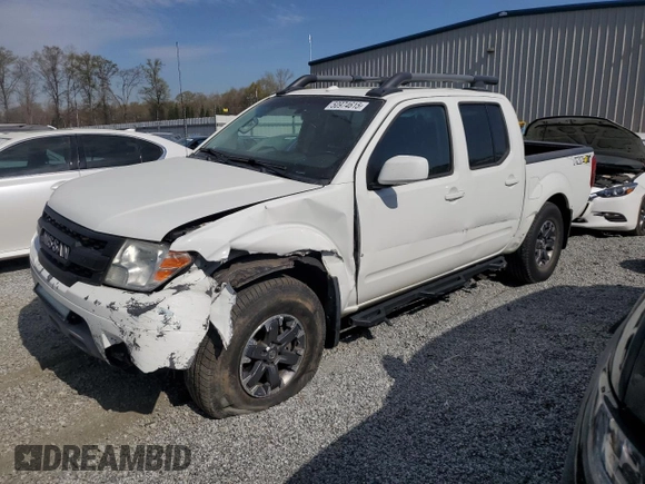 2015 Nissan Frontier Pro-4X with VIN 1N6AD0EV5FN700571, listed as a Copart auction lot 50974615 with 138,930 mi miles and Salvage title. Bid and sale history available at DreamBid. Image 1.