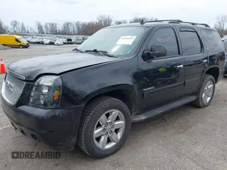 2011 GMC Yukon SLT with VIN 1GKS2CE01BR347675, listed as a IAAI auction lot 41931635 with 247,817 mi miles. Bid and sale history available at carsss.com. Image 2.