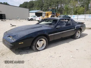 1987 Pontiac Firebird z VIN 1G2FS2184HL222415, wystawiony jako Copart lot #54878805 z przebiegiem 97 287 mil mil oraz Szkody całkowita. Historia ofert i sprzedaży dostępna na DreamBid. Obrazek 1.