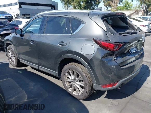2020 Mazda CX-5 Grand Touring with VIN JM3KFADM3L1812649, listed as a IAAI auction lot 42575393 with 102,118 mi miles and . Bid and sale history available at DreamBid. Image 3.