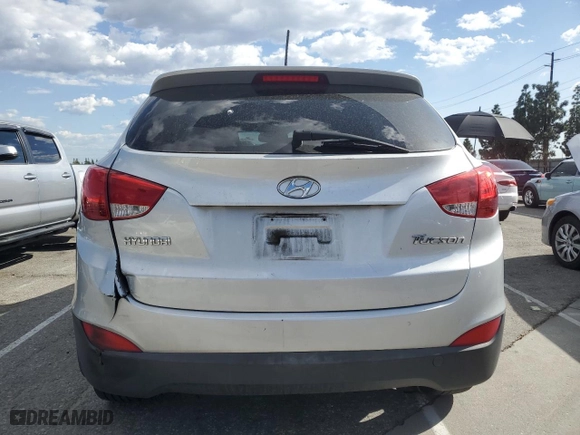 2013 Hyundai Tucson GLS with VIN KM8JU3AC4DU737909, listed as a Copart auction lot 52050955 with 130,707 mi miles and Salvage Title. Bid and sale history available at carsss.com. Image 6.