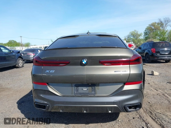 2021 BMW X6 sDrive40i z VIN 5UXCY4C06M9F26841, wystawiony jako IAAI lot #42122749 z przebiegiem 10 072 mil mil oraz . Historia ofert i sprzedaży dostępna na DreamBid. Obrazek 15.