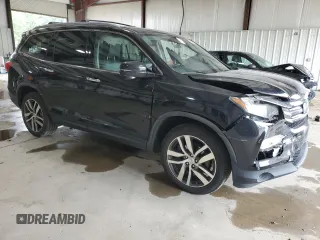 2017 Honda Pilot Touring with VIN 5FNYF6H96HB087634, listed as a Copart auction lot 63535125 with 137,129 mi miles and Salvage title. Bid and sale history available at DreamBid. Image 4.