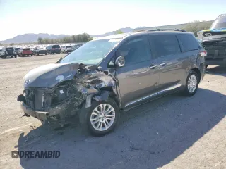 2012 Toyota Sienna XLE AAS with VIN 5TDYK3DCXCS213610, listed as a Copart auction lot 54264365 with 169,052 mi miles and Salvage title. Bid and sale history available at DreamBid. Image 1.
