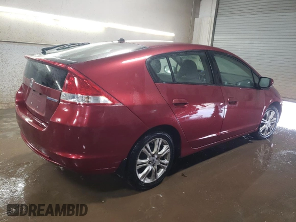 2010 Honda Insight LX with VIN JHMZE2H52AS034613, listed as a Copart auction lot 52701795 with 232,541 mi miles and Salvage Title. Bid and sale history available at DreamBid. Image 3.