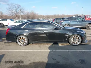 2016 Cadillac CTS-V z VIN 1G6A15S69G0148435, wystawiony jako IAAI lot #41306543 z przebiegiem 22 045 mil mil oraz . Historia ofert i sprzedaży dostępna na DreamBid. Obrazek 13.