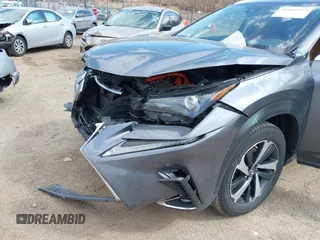 2021 Lexus NX 300h with VIN JTJGJRDZ4M2161869, listed as a IAAI auction lot 41869352 with 33,523 mi miles and . Bid and sale history available at DreamBid. Image 6.