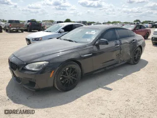 2015 BMW 6 Series 650i with VIN WBA6B2C5XFGB99663, listed as a Copart auction lot 71655204 with 67,258 mi miles and Salvage Title. Bid and sale history available at carsss.com. Image 1.