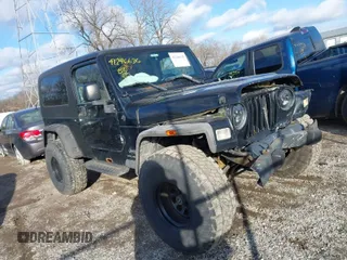 2004 Jeep Wrangler Sport with VIN 1J4FA49SX4P793320, listed as a IAAI auction lot 41246636 with 243,139 mi miles. Bid and sale history available at carsss.com. Image 1.