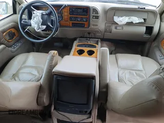 1999 Chevrolet Suburban with VIN 3GNEC16R9XG143471, listed as a Copart auction lot 53856565 with 208,621 mi miles and Salvage title. Bid and sale history available at DreamBid. Image 8.