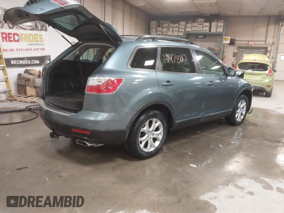 2012 Mazda CX-9 Touring z VIN JM3TB3CV8C0358099, wystawiony jako IAAI lot #41478110 z przebiegiem 151 716 mil mil oraz . Historia ofert i sprzedaży dostępna na DreamBid. Obrazek 4.