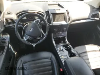2020 Ford Edge SEL z VIN 2FMPK3J9XLBA59093, wystawiony jako Copart lot #52542645 z przebiegiem 128 059 mil mil oraz Czysty tytuł • Clean title. Historia ofert i sprzedaży dostępna na DreamBid. Obrazek 8.