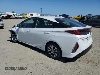 2021 Toyota Prius LE z VIN JTDKAMFP7M3191079, wystawiony jako Copart lot #57529195 z przebiegiem 52 809 mil mil oraz Szkoda całkowita • Salvage title. Historia ofert i sprzedaży dostępna na DreamBid. Obrazek 2.