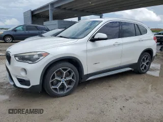 2016 BMW X1 xDrive28i with VIN WBXHT3C34GP887401, listed as a Copart auction lot 52255655 with 129,599 mi miles and Clean Title. Bid and sale history available at carsss.com. Image 1.