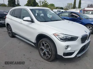 2019 BMW X1 sDrive28i z VIN WBXHU7C52K5L09873, wystawiony jako IAAI lot #41866552 z przebiegiem 52 913 mil mil oraz . Historia ofert i sprzedaży dostępna na DreamBid. Obrazek 1.