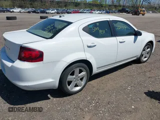 2013 Dodge Avenger SE with VIN 1C3CDZABXDN551796, listed as a IAAI auction lot 42142302 with 999,999 mi miles. Bid and sale history available at carsss.com. Image 4.