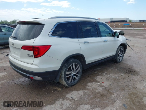 2017 Honda Pilot Touring with VIN 5FNYF6H9XHB034001, listed as a IAAI auction lot 42092549 with 142,422 mi miles and . Bid and sale history available at DreamBid. Image 4.