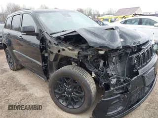 2021 Jeep Grand Cherokee 80th Anniversary with VIN 1C4RJFBG7MC828116, listed as a IAAI auction lot 42118355 with 57,240 mi miles and . Bid and sale history available at DreamBid. Image 6.