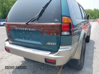 2004 Mitsubishi Montero XLS z VIN JA4MT31R34J007557, wystawiony jako IAAI lot #42368032 z przebiegiem 172 104 mil mil oraz . Historia ofert i sprzedaży dostępna na DreamBid. Obrazek 6.