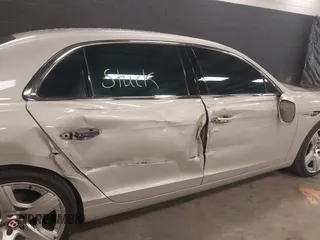 2015 Bentley Flying Spur V8 with VIN SCBET9ZAXFC042716, listed as a IAAI auction lot 42621840 with 47,299 mi miles and . Bid and sale history available at DreamBid. Image 6.