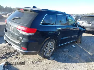2018 Jeep Grand Cherokee Summit with VIN 1C4RJFJG1JC211047, listed as a IAAI auction lot 41133865 with 66,588 mi miles and . Bid and sale history available at DreamBid. Image 4.