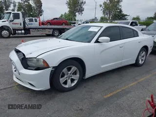 2014 Dodge Charger SE with VIN 2C3CDXBG3EH131242, listed as a IAAI auction lot 42121260 with 231,452 mi miles and . Bid and sale history available at DreamBid. Image 2.