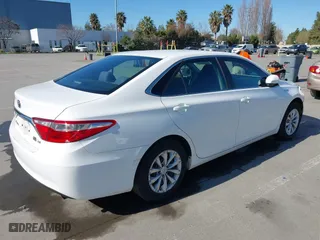 2015 Toyota Camry Hybrid LE with VIN 4T1BD1FK9FU155428, listed as a IAAI auction lot 41666063 with 154,608 mi miles. Bid and sale history available at carsss.com. Image 4.