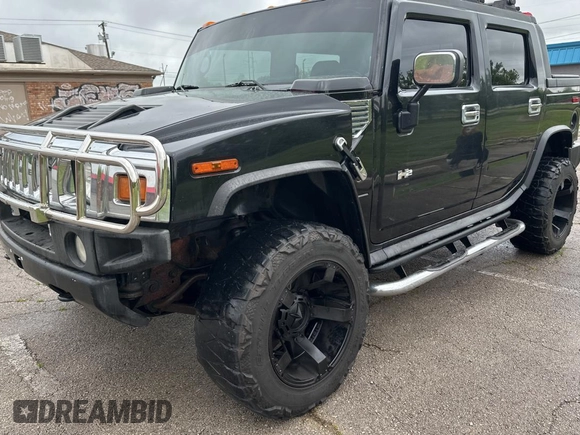 2005 Hummer H2 SUT z VIN 5GRGN22U15H123289, wystawiony jako Copart lot #55254575 z przebiegiem 161 105 mil mil oraz Tytuł czysty. Historia ofert i sprzedaży dostępna na DreamBid. Obrazek 2.