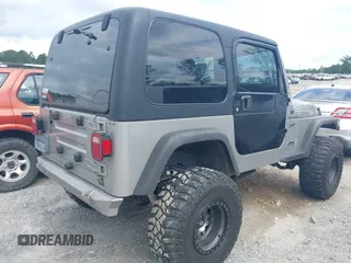 2002 Jeep Wrangler Sport with VIN 1J4FA49S52P717811, listed as a IAAI auction lot 42449753 with 252,258 mi miles and . Bid and sale history available at DreamBid. Image 4.