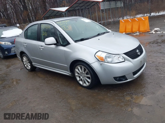 2011 Suzuki SX4 z VIN JS2YC5A41B6300385, wystawiony jako IAAI lot #41570810 z przebiegiem 117 847 mil mil oraz . Historia ofert i sprzedaży dostępna na DreamBid. Obrazek 1.