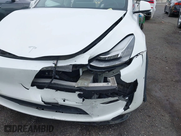 2022 Tesla Model Y Long Range z VIN 7SAYGDEE7NF389788, wystawiony jako IAAI lot #42014111 z przebiegiem 37 606 mil mil oraz . Historia ofert i sprzedaży dostępna na DreamBid. Obrazek 6.