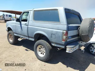 1995 Ford Bronco Custom with VIN 1FMEU15H5SLB65909, listed as a IAAI auction lot 41880810 with 216,927 mi miles. Bid and sale history available at carsss.com. Image 3.